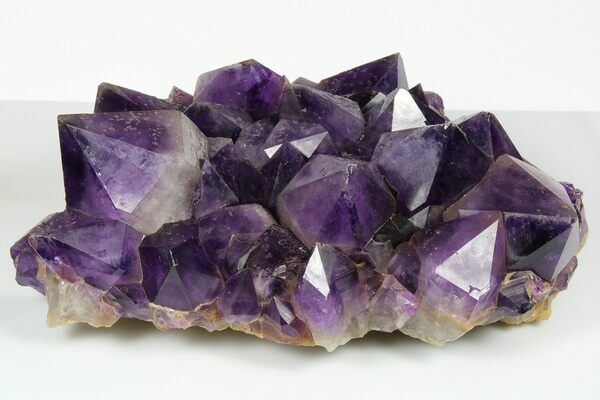 An amethyst crystal cluster from the Democratic Republic of the Congo with particularly large crystals and deep coloration.